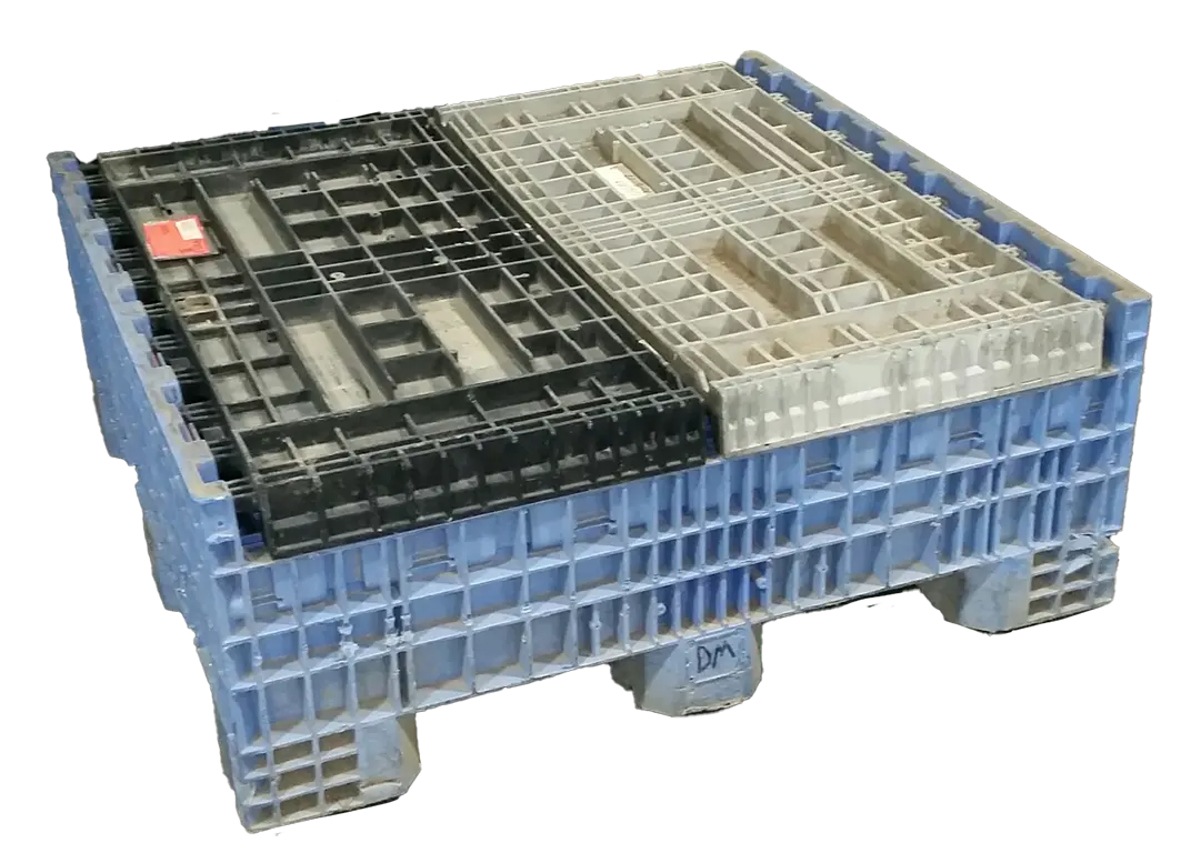 Reconditioned mixed‑color plastic bulk container with blue sides and black interior, shown collapsed.