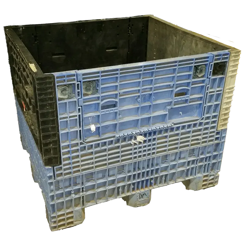Reconditioned mixed‑color plastic bulk container with blue sides and black interior, shown open and empty.